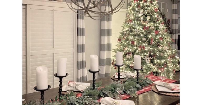 Holiday table in festive dining room. 